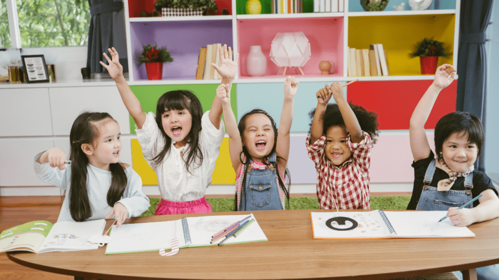 Children's with confident raising there hands